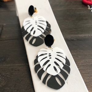 These palm leaf inspired earrings are show stoppers! Black and white acrylic.